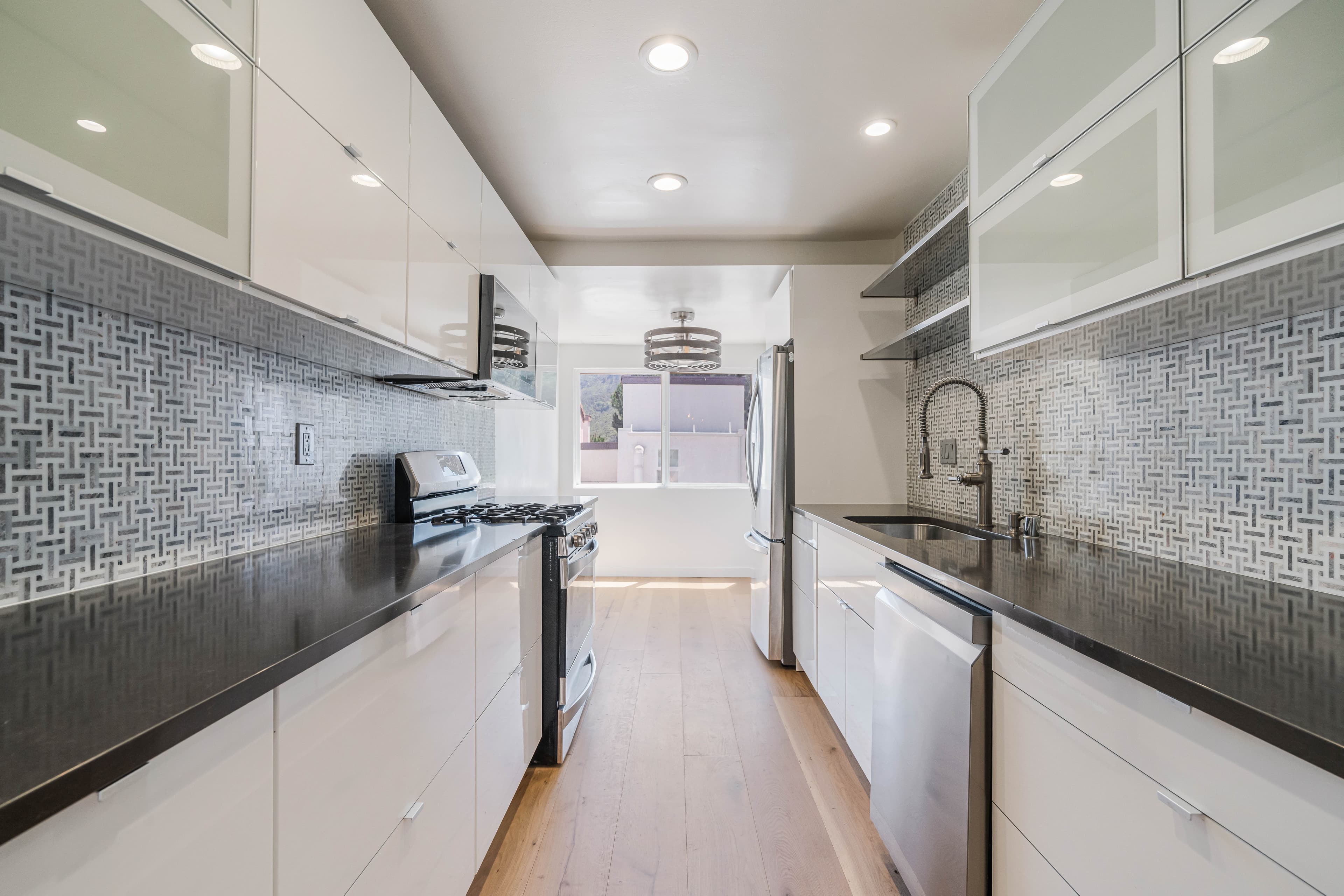 Remodeled kitchen at 1534 Palisades Drive, a Pacific Palisades townhome purchase in which Adel Dibaei represented the buyer.